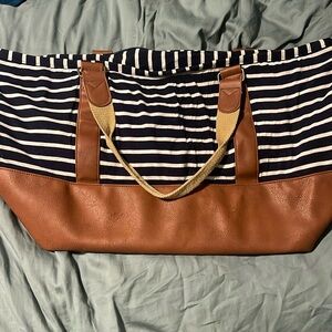 Madden Girl striped travel/ duffel bag with shoulder strap.